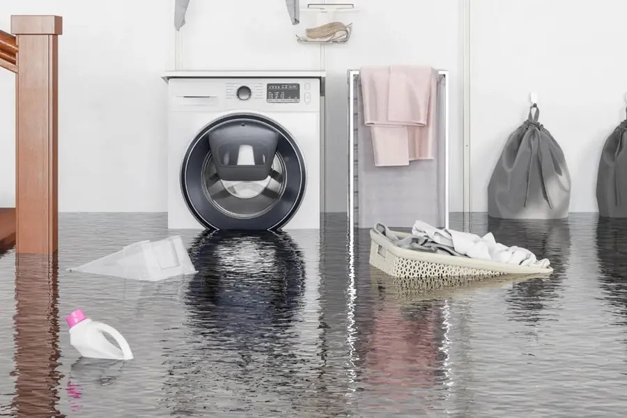 A flooded laundry room from a failed washing machine supply line in Southwest Fort Worth